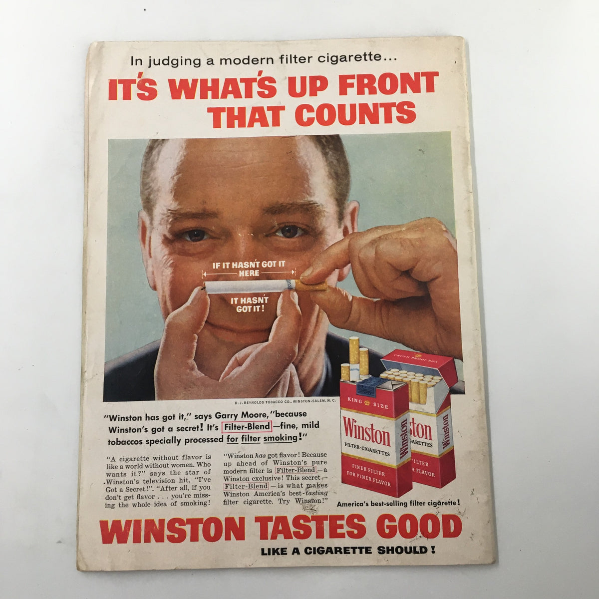 Cover of a vintage advertisement featuring Winston Cigarettes with the title 'It's What's Up Front That Counts', highlighting a modern filter cigarette and promoting its taste. The image is relevant to the history of cigarette marketing.