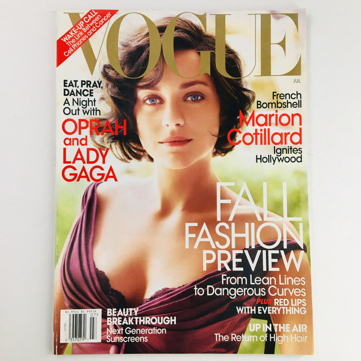 Cover of Vogue Magazine July 2010 featuring French actress Marion Cotillard, showcasing summer fashion trends and beauty tips.