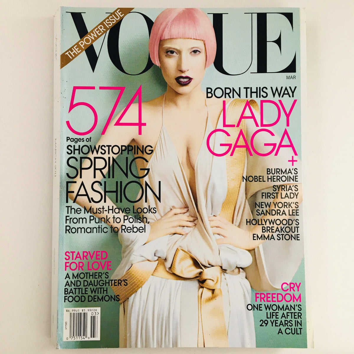 Vogue Magazine March 2011 featuring Lady Gaga on the cover, showcasing bold fashion and artistic style, highlighting her influence in pop culture.