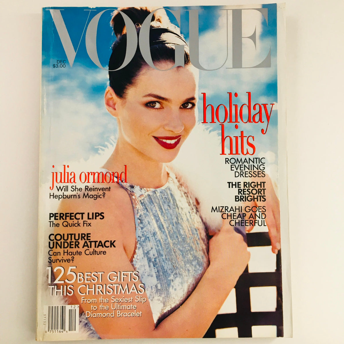 Vogue Magazine December 1995 cover featuring English actress Julia Ormond, highlighting fashion insights and holiday hits such as romantic evening dresses.