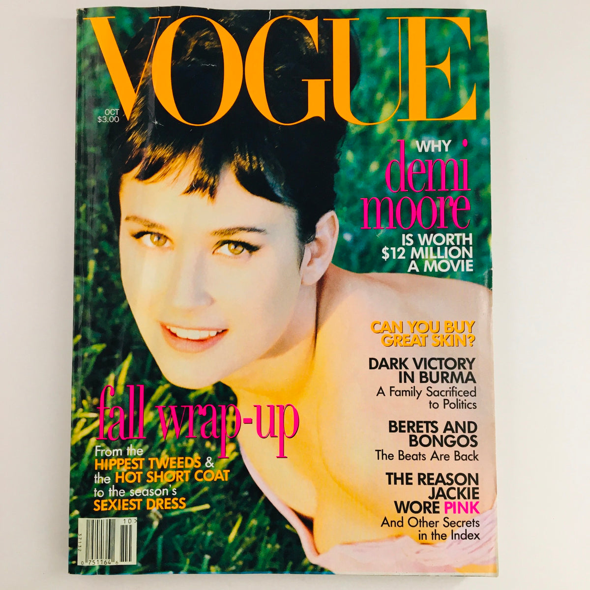 Cover of Vogue Magazine from October 1995 featuring American actress Demi Moore, showcasing vibrant colors and bold typography along with headlines about fashion and beauty.