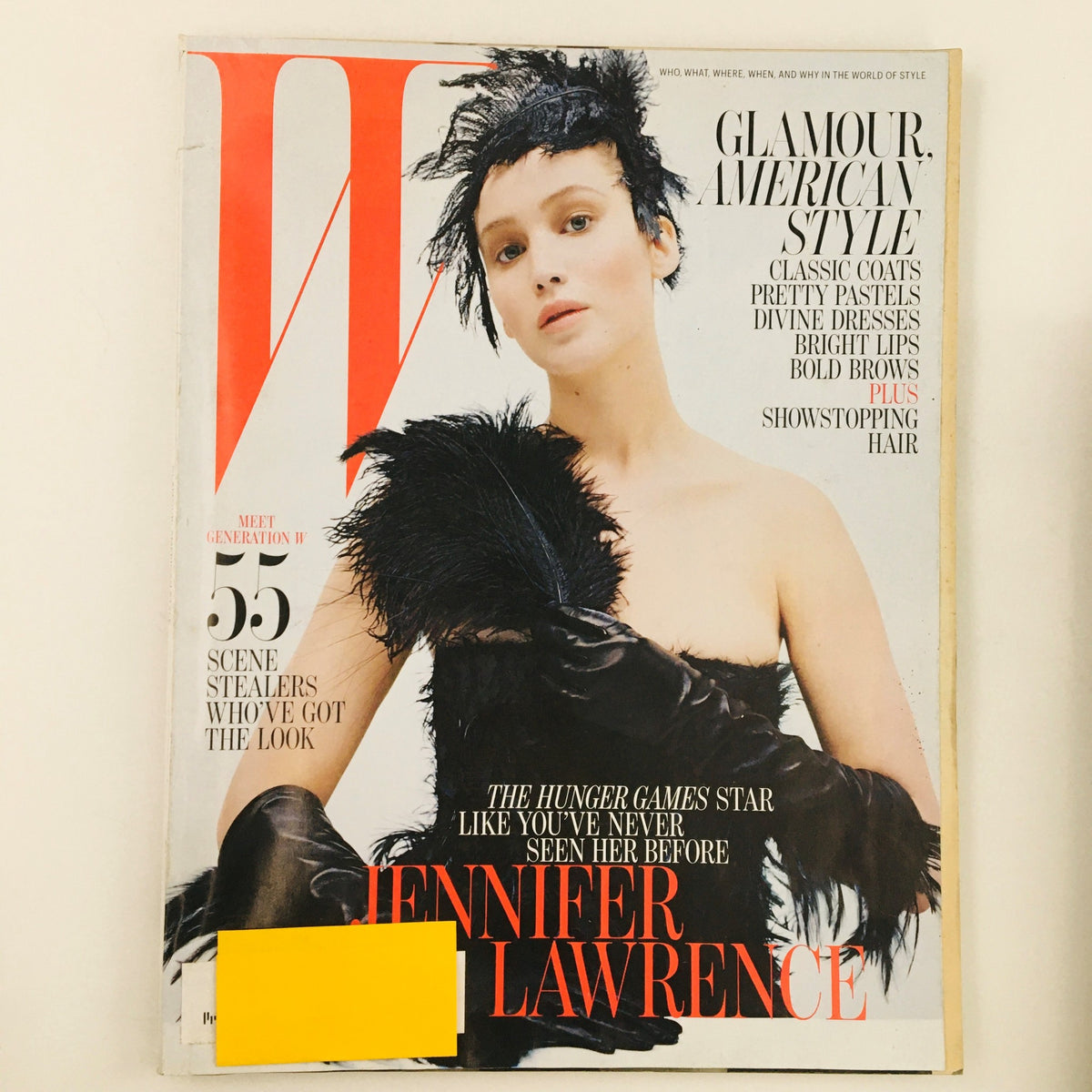 W Magazine October 2012 cover featuring actress Jennifer Lawrence showcasing glamour and American style, highlighted by dramatic fashion elements.