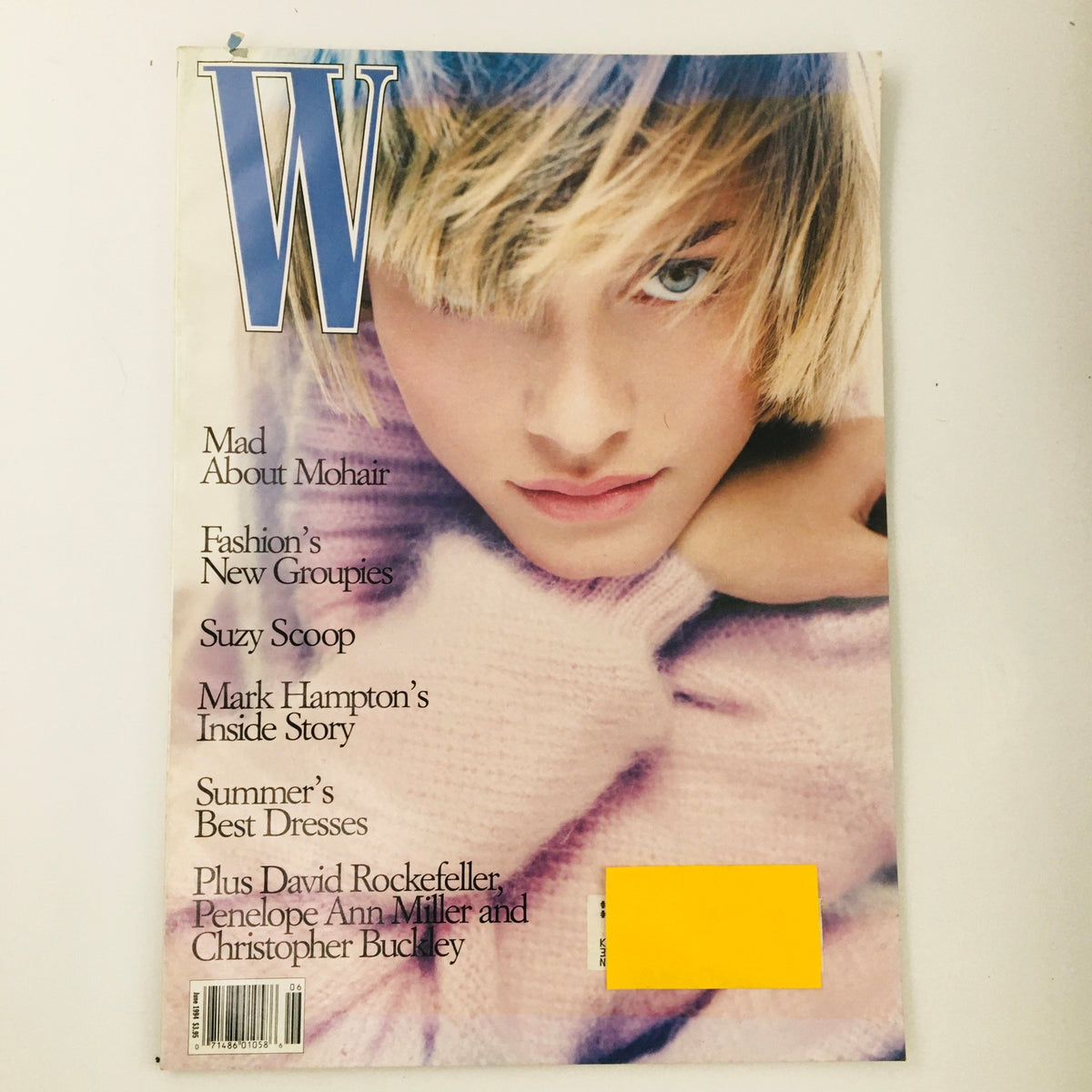 Cover of W Magazine June 1994 featuring American model Amber Valletta, showcasing early 90s fashion with headlines about mohair, fashion groupies, and Mark Hampton's inside story.