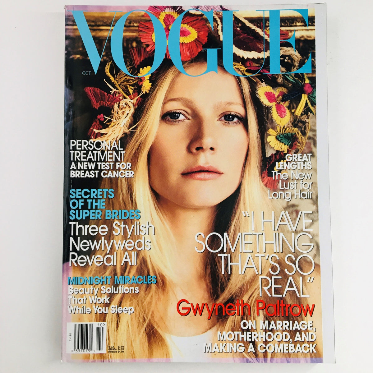 Vogue Magazine October 2005 featuring American actress Gwyneth Paltrow on the cover, showcasing her stunning beauty amidst floral accents. An iconic vintage issue reflecting early 2000s fashion and culture.