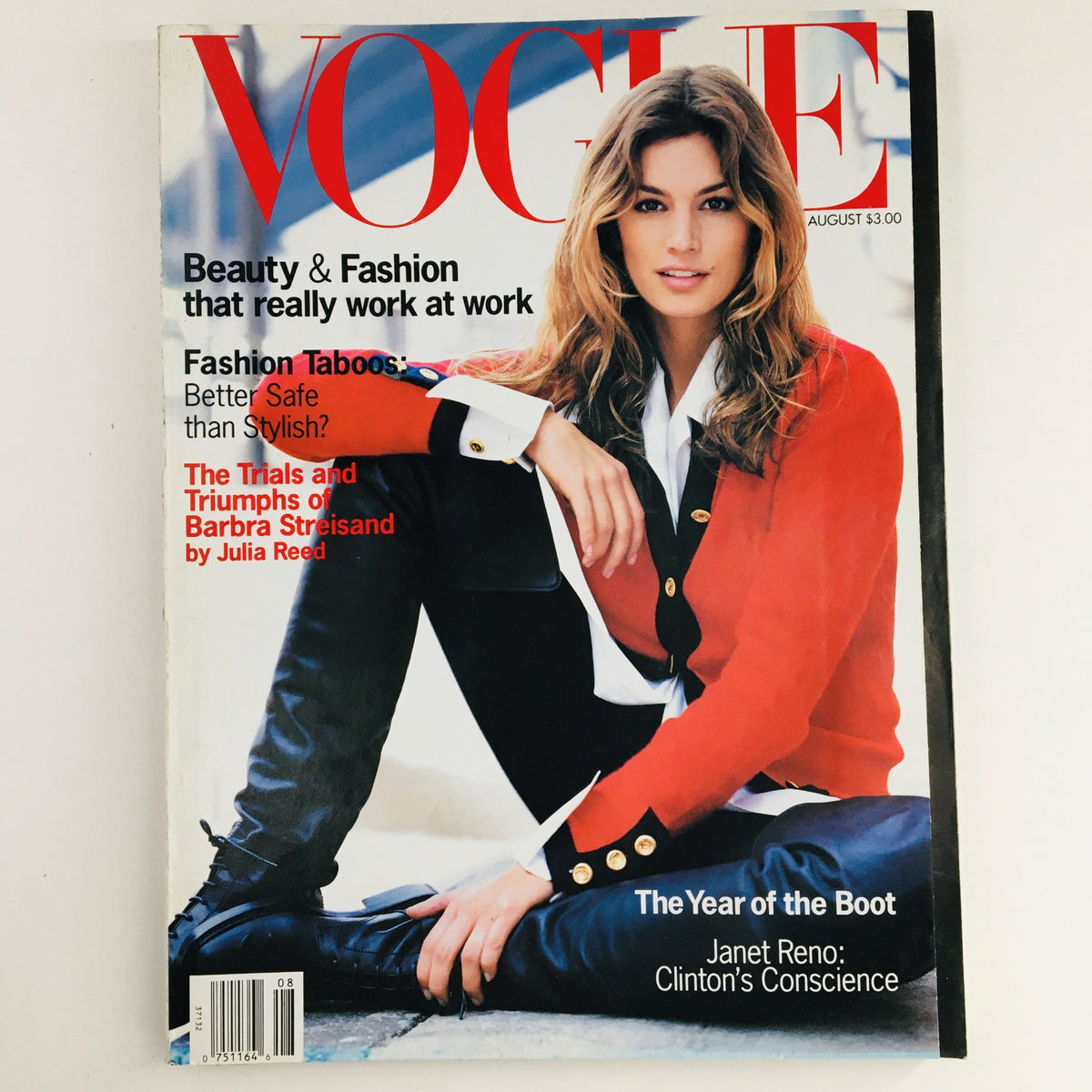 Vogue Magazine August 1993 featuring Cindy Crawford on the cover, highlighting beauty and fashion trends of the 90s era. The magazine showcases an iconic look with a red jacket and a stylish seated pose, perfect for collectors of fashion history.