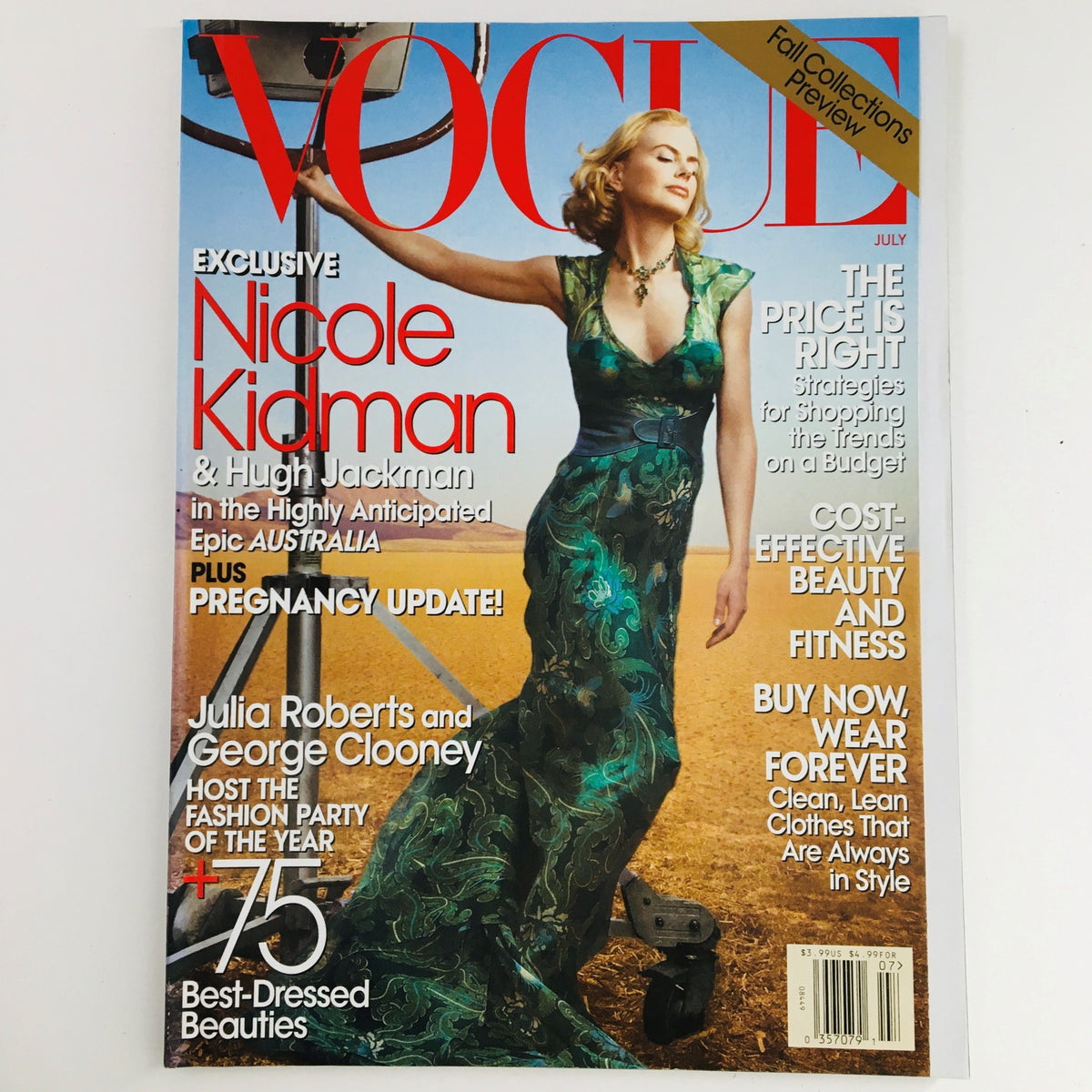 Vogue Magazine July 2008 cover featuring Australian actress Nicole Kidman in a stunning dress, showcasing the intersection of fashion and celebrity culture. This vintage issue includes Hugh Jackman, Julia Roberts, and George Clooney, making it a collector's item for fans of high fashion and film.