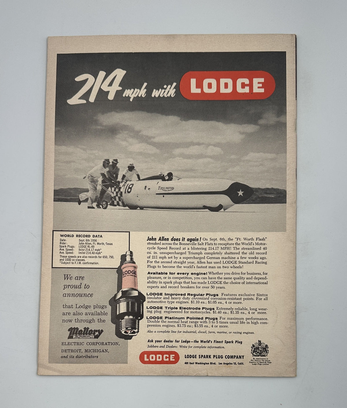 Cover of Cycle Magazine from November 1956 featuring '214 mph with Lodge' advertisement, showcasing a speedboat and celebrating Triumph's world record at Dodge City GP, focuses on the achievements of Billy Meier in motorcycle racing.