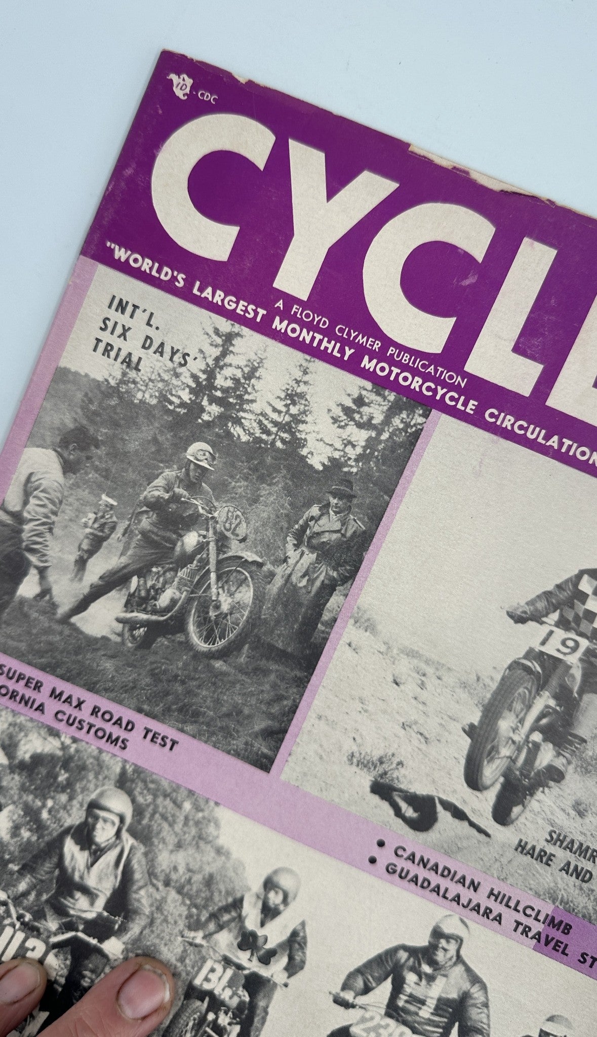 Close-up of the Cycle Magazine January 1961 cover showcasing the NSU Super Max Road Test and events like the Riverside TT Hillclimb. The purple background highlights key motorcycle features.