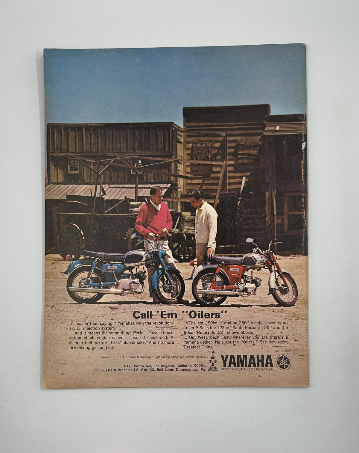 Cycle Magazine November 1964 advertisement for Yamaha motorcycles, featuring two vintage models in a Western-style setting. The ad promotes Yamaha's motorbike offerings and highlights their reliability.