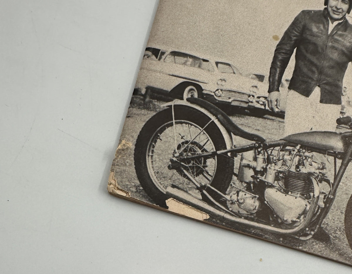 Close-up of the corner of Cycle Magazine March 1958 featuring Big Bear Husqvarna Silver Arrow A.M.A. Races, showing wear and tear indicative of its vintage condition.