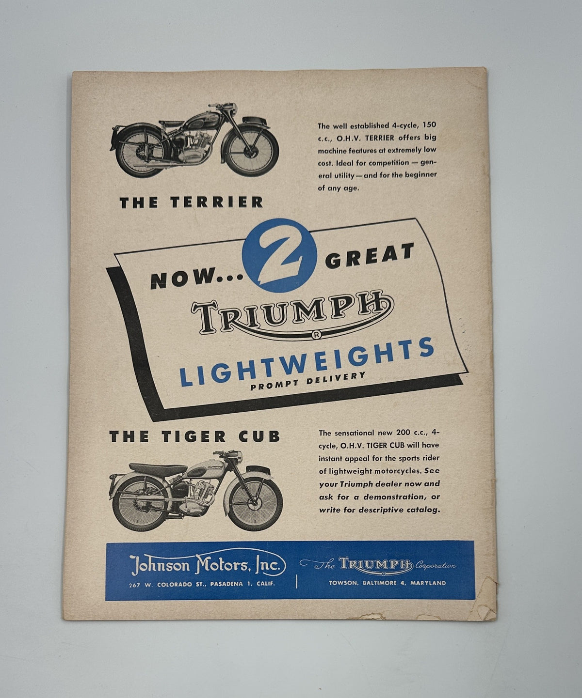 Vintage Triumph motorcycle advertisement featuring The Terrier and The Tiger Cub models, now available for prompt delivery. Accompanied by the title 'Cycle Magazine July 1954 Catalina Grand Prix Dodge City Velocette.'