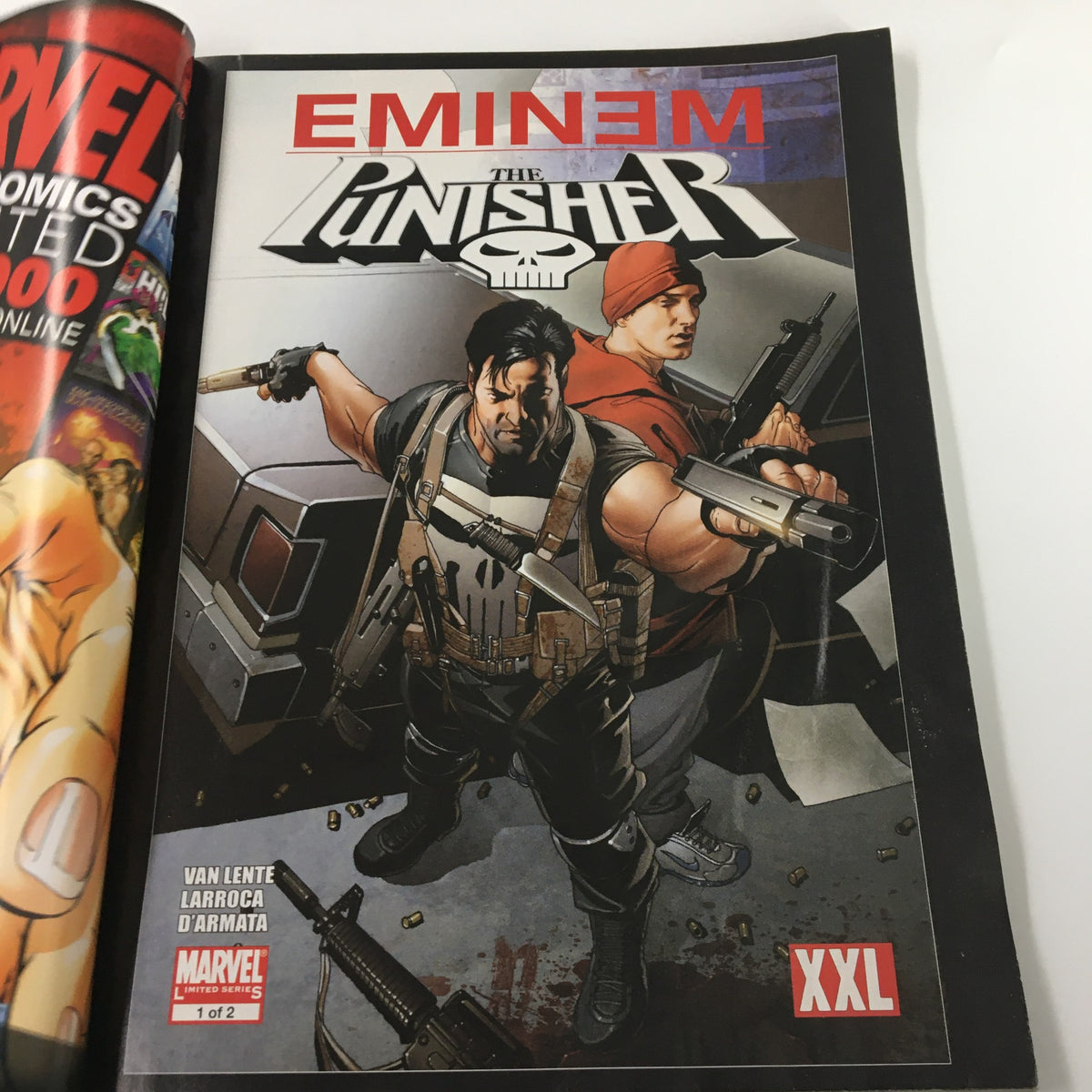 Inside page of XXL Magazine June 2009 featuring Eminem and The Punisher comic, showcasing the main character with weapons.