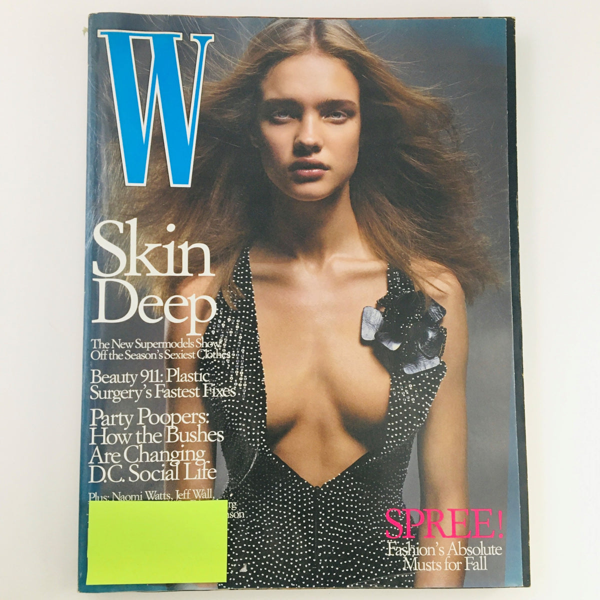 W Magazine October 2002 featuring Russian model Natalia Vodianova on the cover, showcasing her stunning look in a stylish outfit. The magazine highlights early 2000s fashion trends.