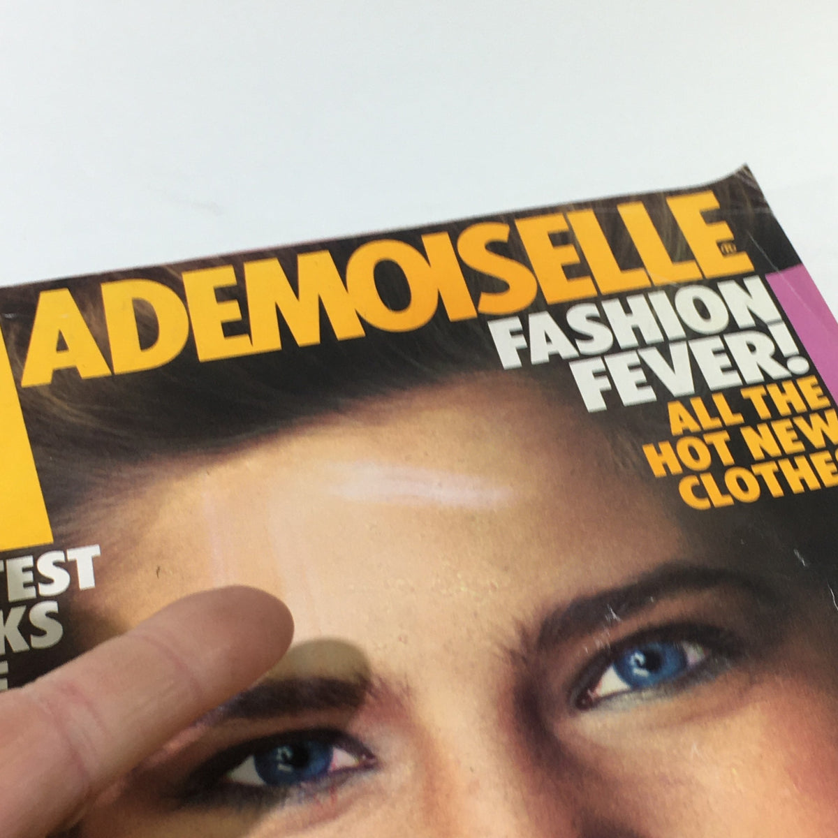 Vintage Mademoiselle Magazine August 1982 cover featuring text 'Fashion Fever' and close-up of a model's face, showcasing early '80s fashion trends.