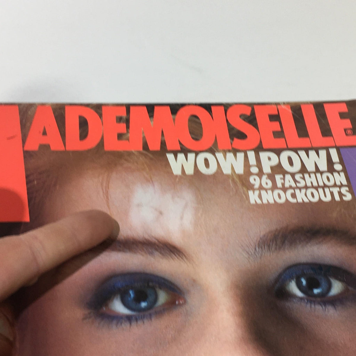Close-up image of the VTG Mademoiselle Magazine: February 1983 cover, highlighting the text and model details with vibrant design elements.