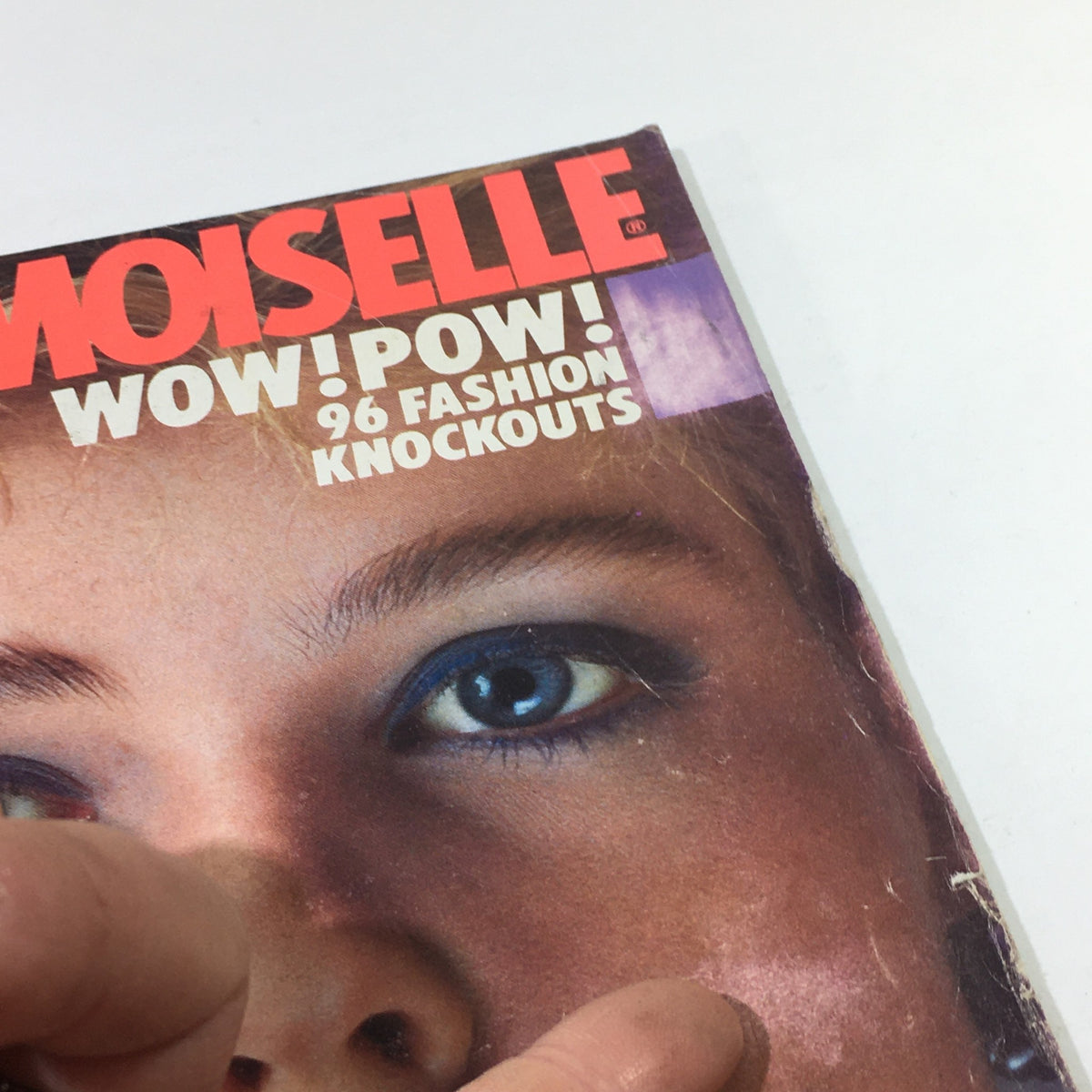 Detail view of the Mademoiselle Magazine: February 1983 showcasing vibrant makeup and striking fashion elements from the 1980s.
