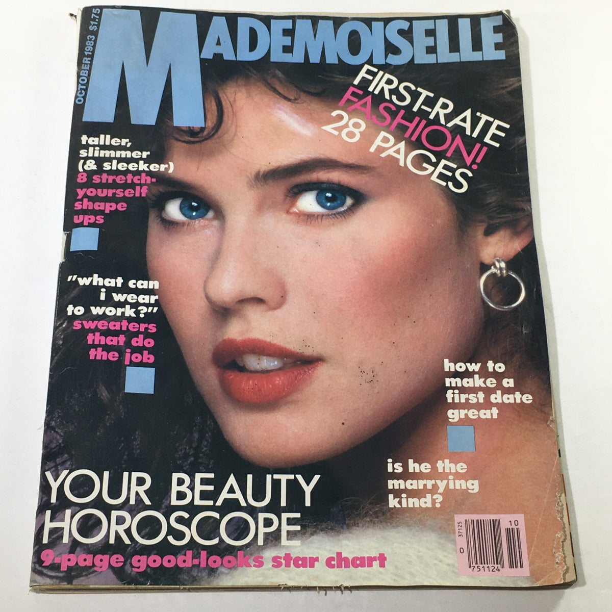 Cover of VTG Mademoiselle Magazine: October 1983 featuring a close-up of a model with striking blue eyes and bold makeup, promoting fashion and beauty tips.