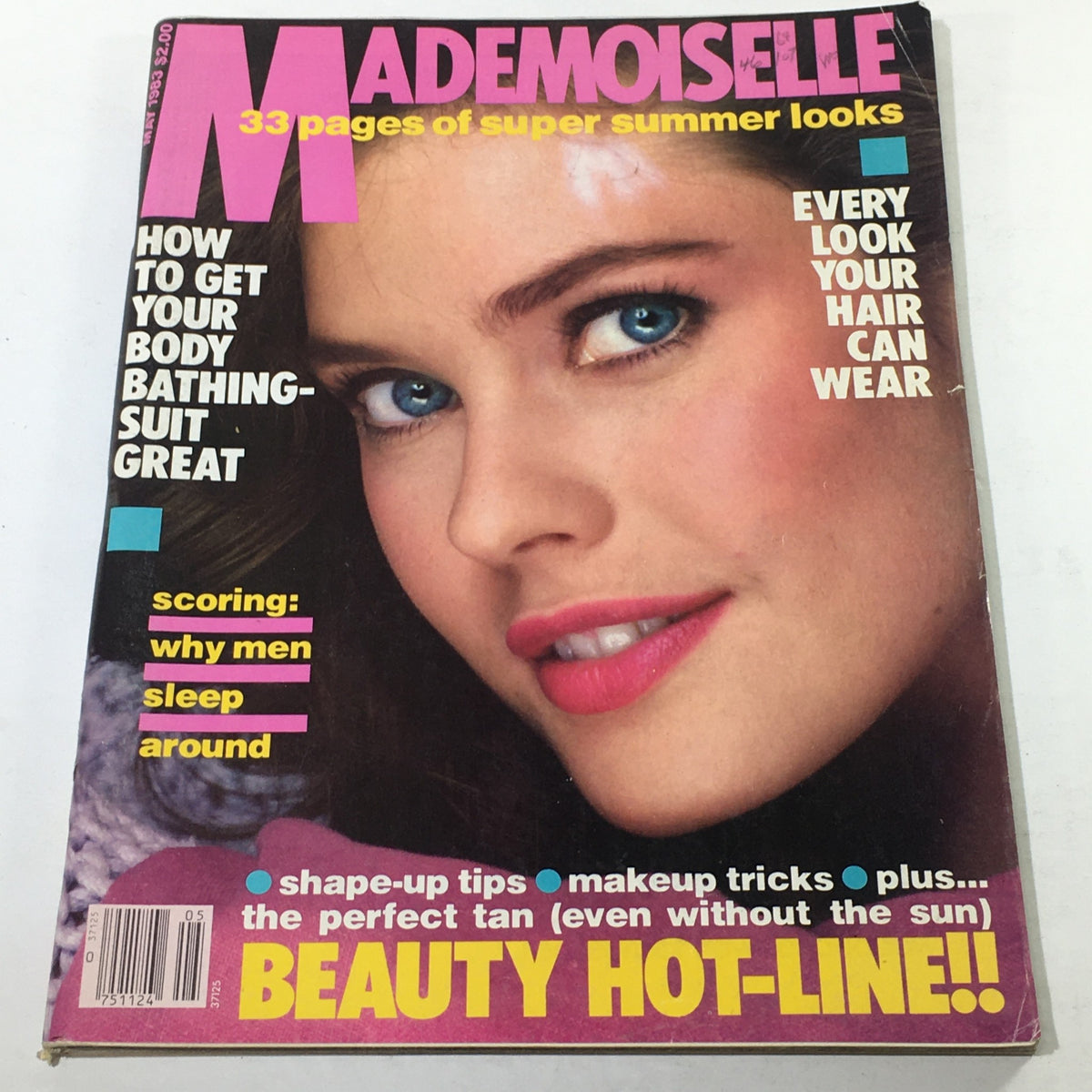 Vintage Mademoiselle Magazine May 1983 highlighting beauty tips and summer fashion, featuring a close-up of a model with striking blue eyes on the cover.