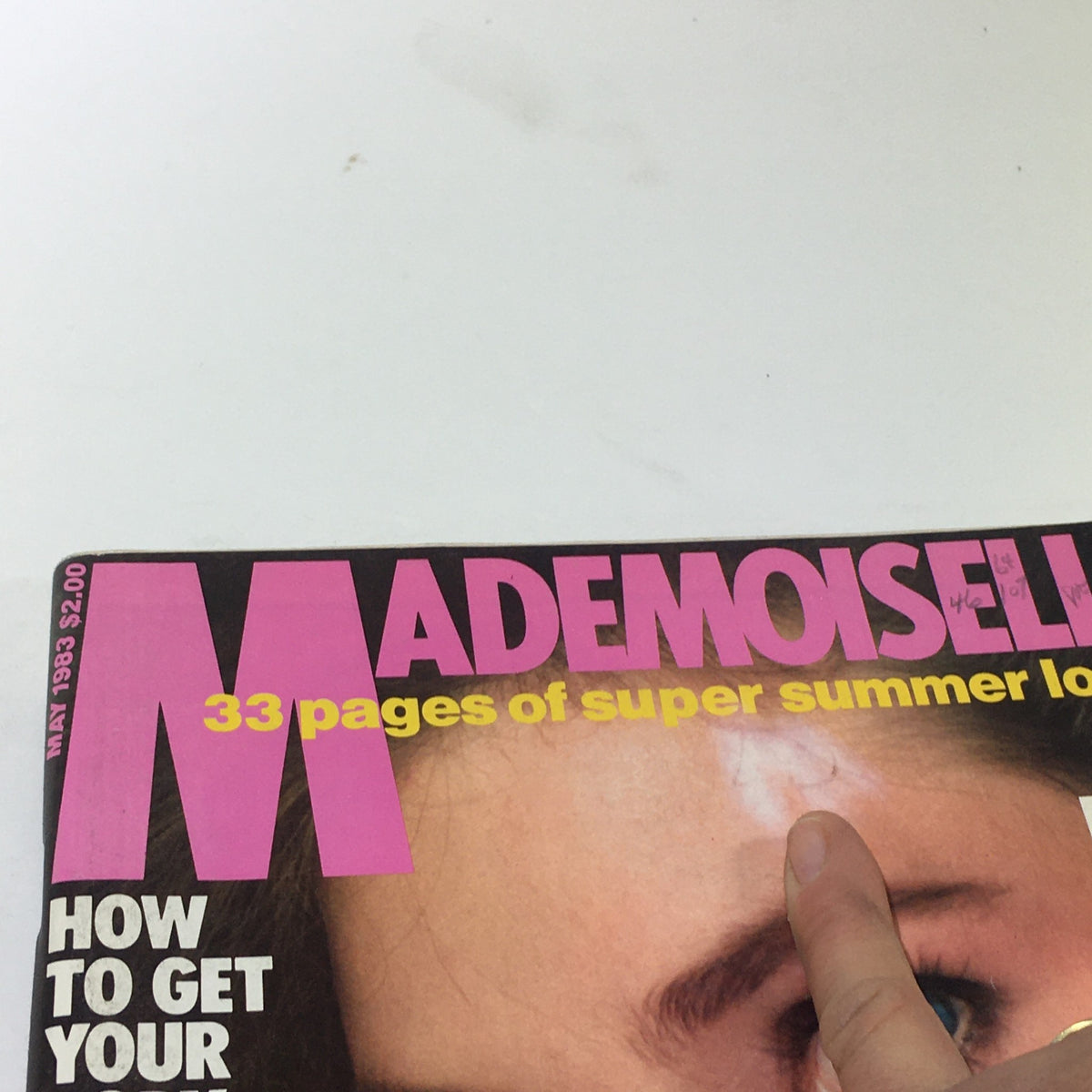 Close-up view of the Vintage Mademoiselle Magazine May 1983 cover, displaying bold text and detailed summer beauty features.