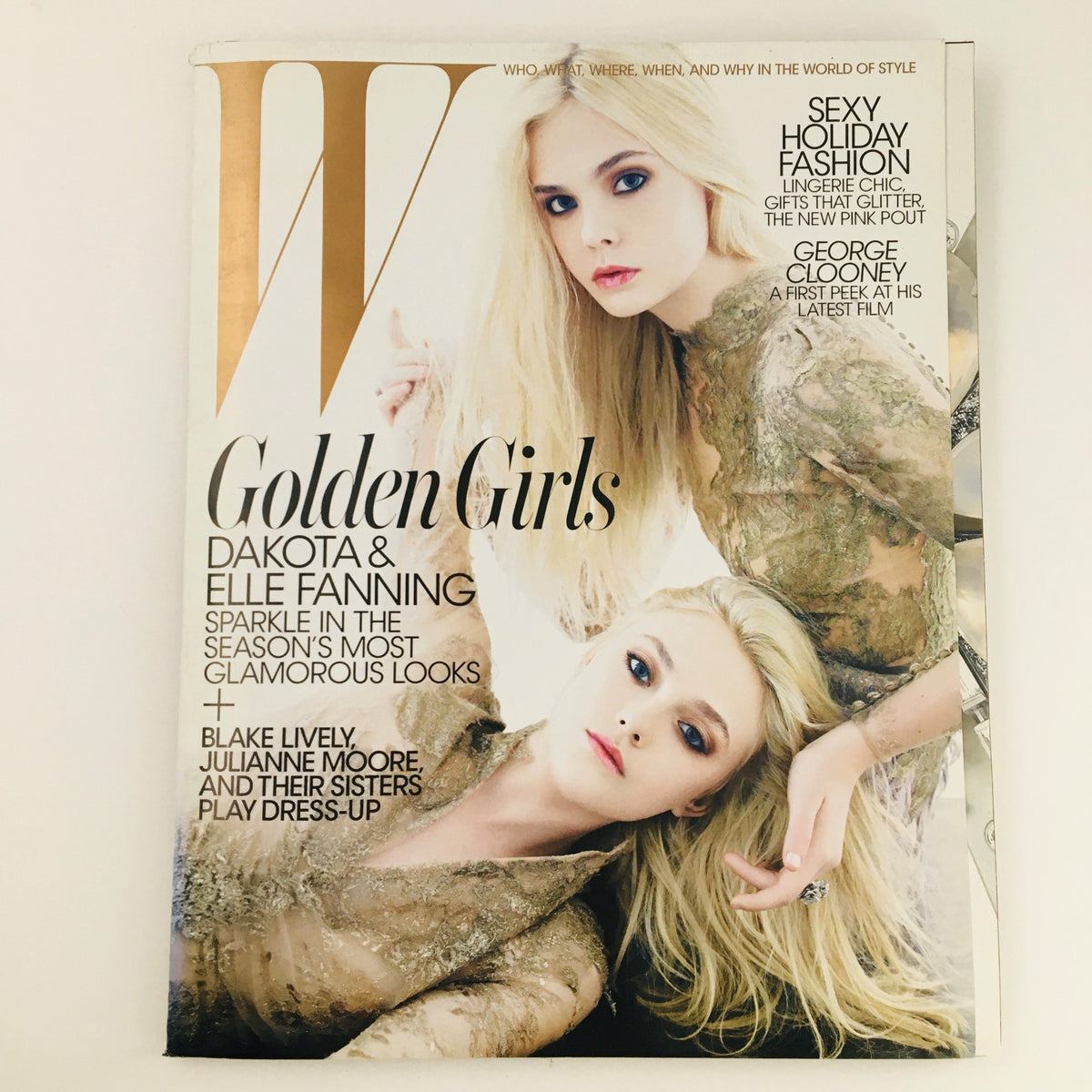 W Magazine December 2011 cover featuring Golden Girls Dakota & Elle Fanning, showcasing their glamorous looks in a styled photo shoot.