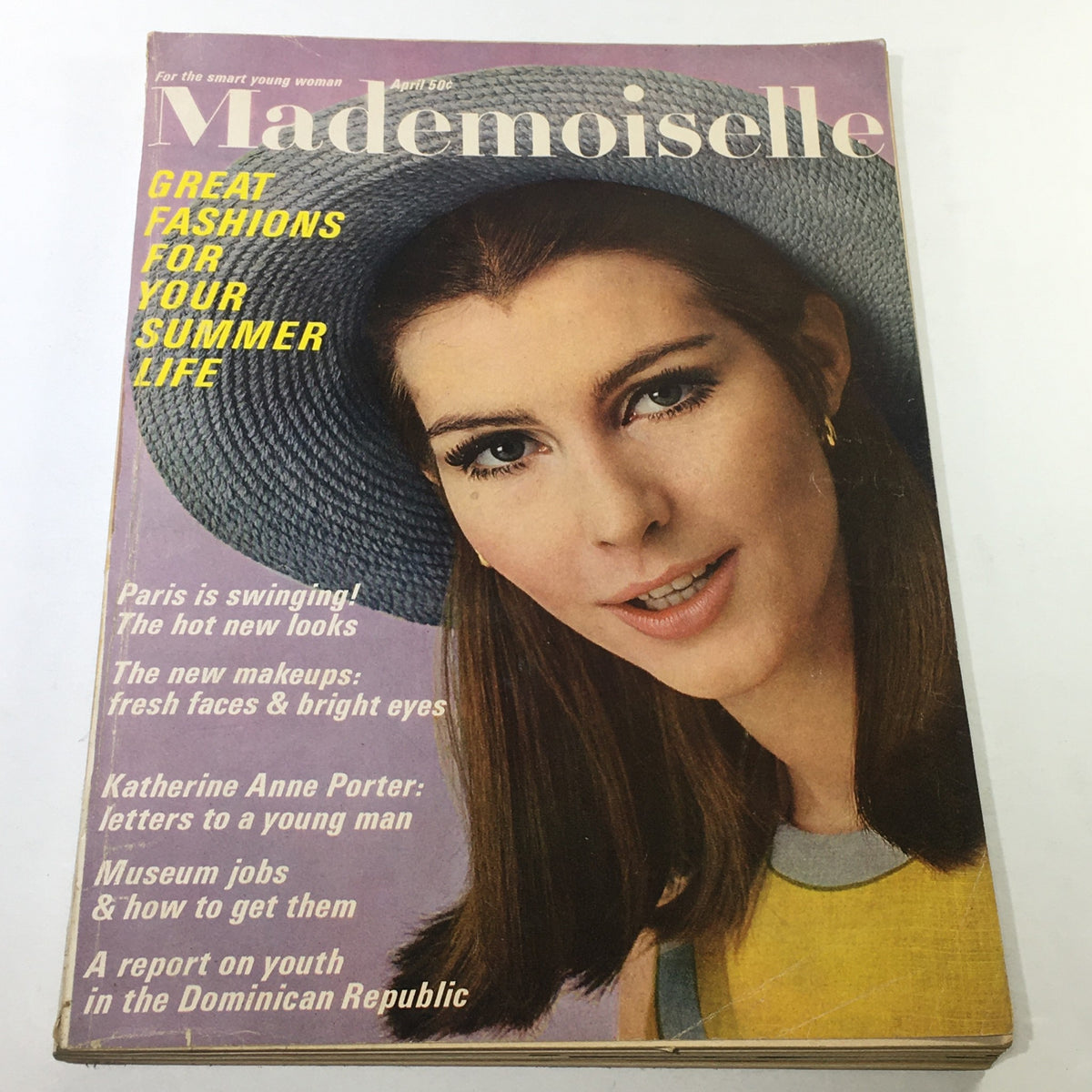 VTG Mademoiselle Magazine: April 1966 cover showcasing great fashions for summer, featuring a model wearing a stylish hat and a colorful outfit, highlighting the fashion trends of the 1960s.