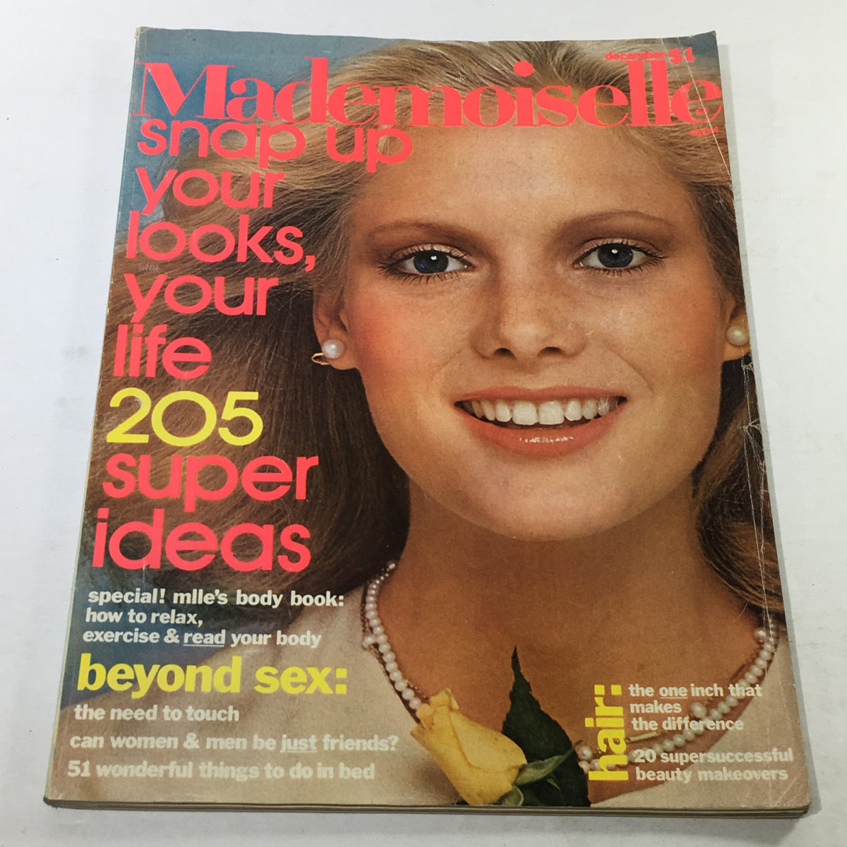 Vintage Mademoiselle Magazine from December 1975 featuring Lisa Cooper's cover art. The cover highlights the theme 'snap up your looks, your life', showcasing 205 super ideas for fashion and lifestyle.