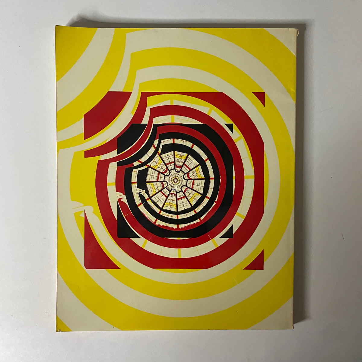Cover of Art in America Magazine June 1965 featuring a vibrant spiral design in yellow, red, and black, highlighting its focus on the Guggenheim Museum.