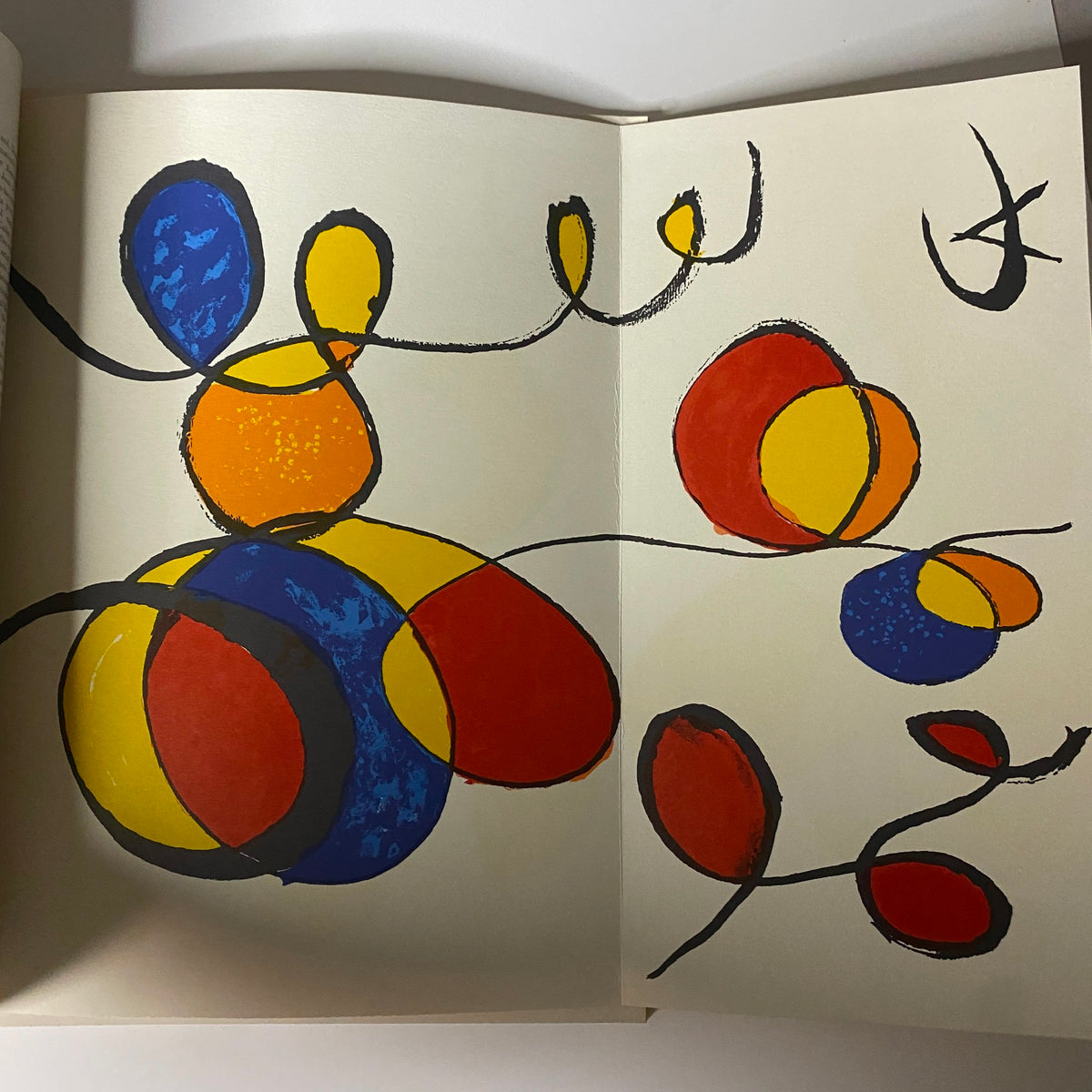 Artistic illustration from the May 1970 issue of Art in America Magazine, showcasing vibrant abstract shapes in red, blue, and yellow, reflecting modern artistic expressions related to the magazine's themes.