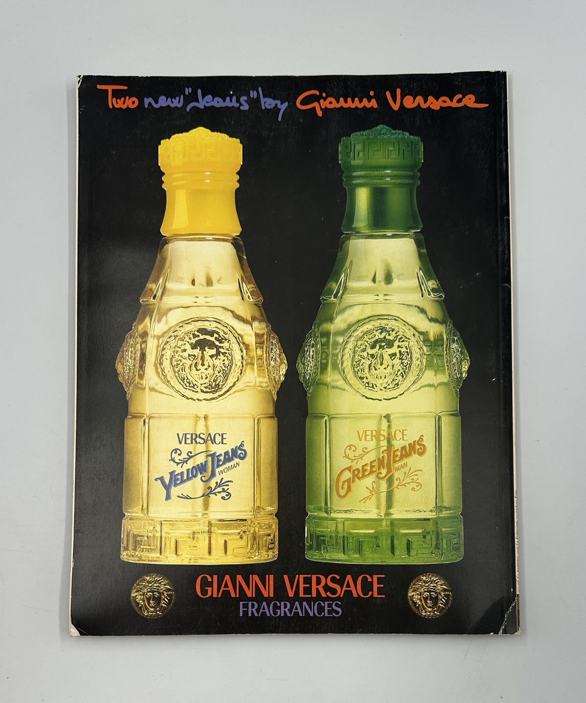 Advertisement for Gianni Versace fragrances featuring bottles of Yellow Jeans and Green Jeans, featured in Wallpaper Magazine January/February 1997.
