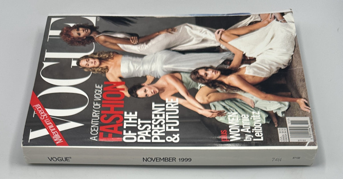 Side view of Vogue Magazine November 1999 showcasing the cover design featuring supermodels Kate Moss, Gisele Bündchen, Lauren Hutton, and Iman, with a focus on fashion of the past, present, and future.