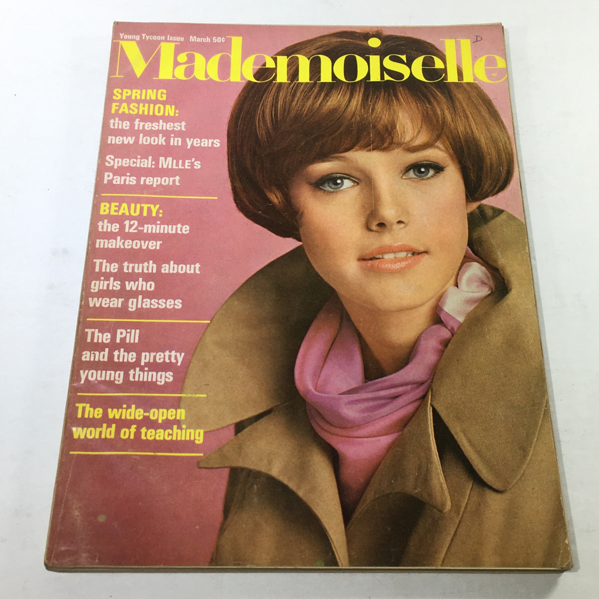 VTG Mademoiselle Magazine March 1967 cover featuring a model with a stylish bob haircut, wearing a coat and pink scarf, showcasing spring fashion and beauty tips.