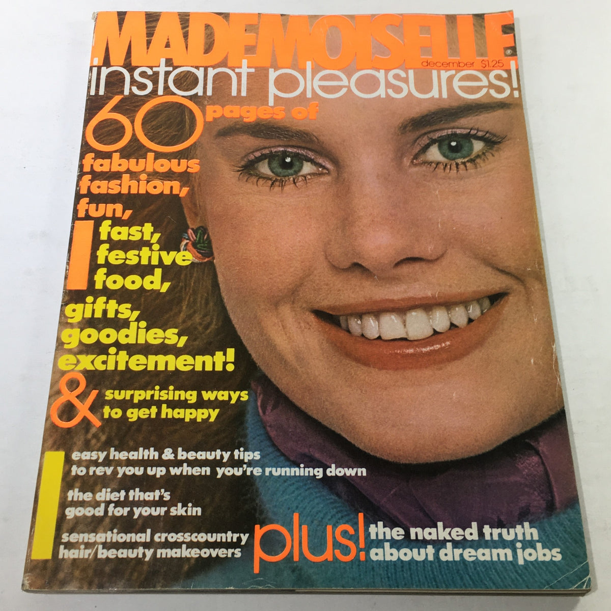 Vintage Mademoiselle Magazine from December 1976 featuring a smiling woman on the cover, showcasing the iconic fashion and style of the 1970s. Ideal for collectors and vintage fashion enthusiasts.