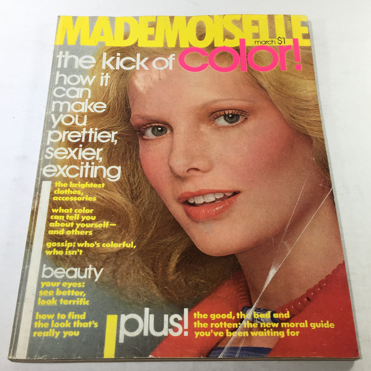 Vintage Mademoiselle Magazine from March 1976 showcasing a beautiful fashion cover featuring a model with wavy blonde hair and bright blue eyes, emphasizing vibrant colors and iconic 1970s fashion style.