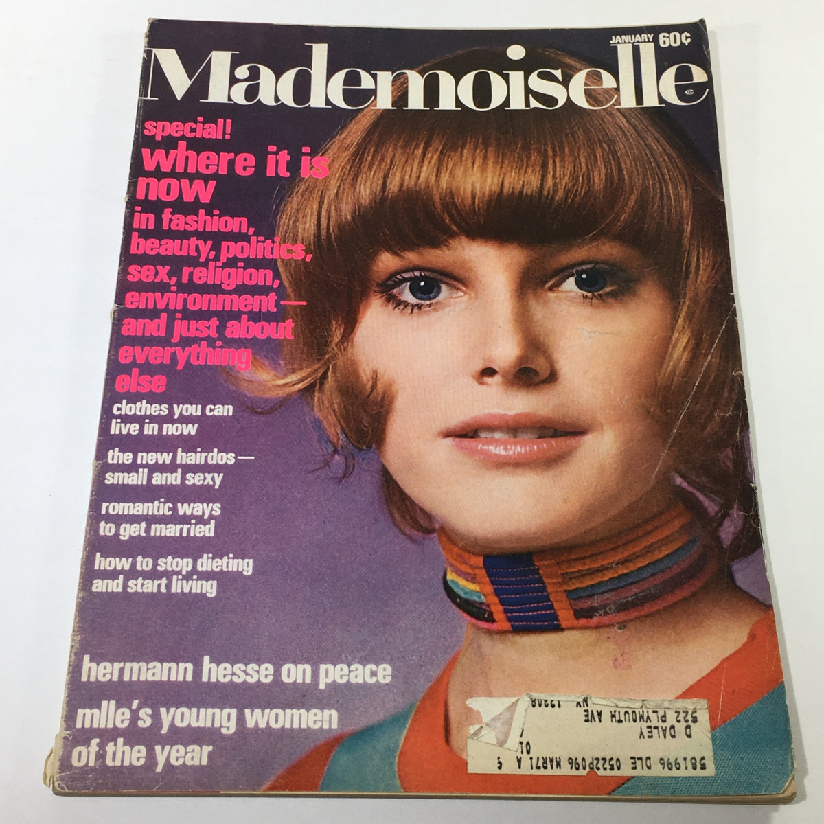 Vintage Mademoiselle Magazine Cover from January 1971 featuring a model with short hair and a colorful neckline, highlighting the essence of 1970s fashion and culture.