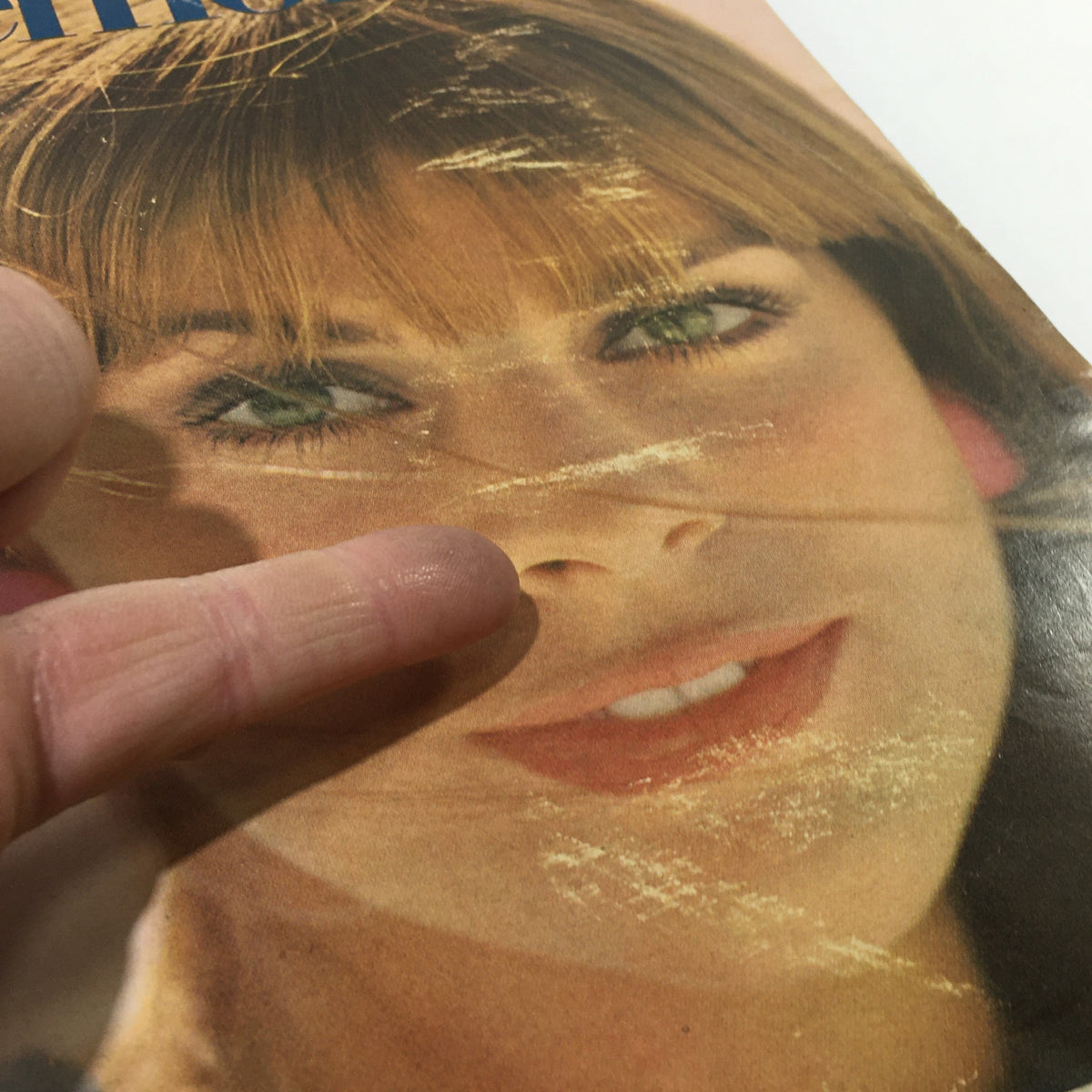 Detailed view of the model on the cover of VTG Mademoiselle Magazine: April 1967, focusing on her face and hair style.