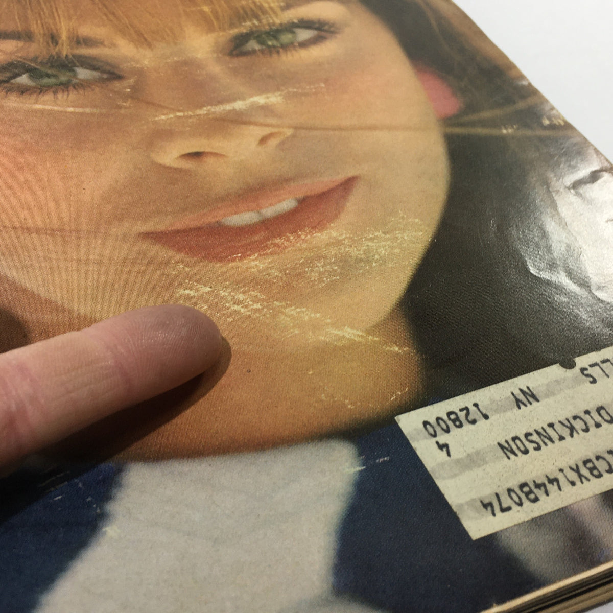 Full view of the model featured on VTG Mademoiselle Magazine: April 1967 cover, emphasizing her smile and vintage makeup.