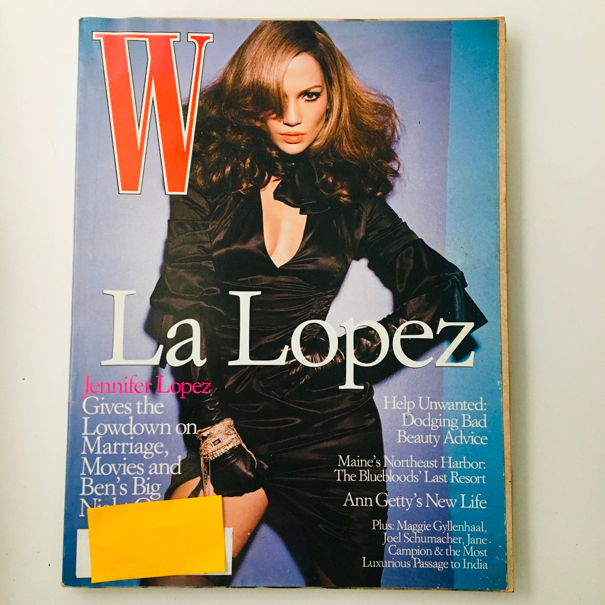 W Magazine October 2003 cover featuring American actress Jennifer Lopez in a stylish black dress, highlighting the 'Here Comes The Bride' feature. A vintage collectible magazine showcasing early 2000s fashion and pop culture.