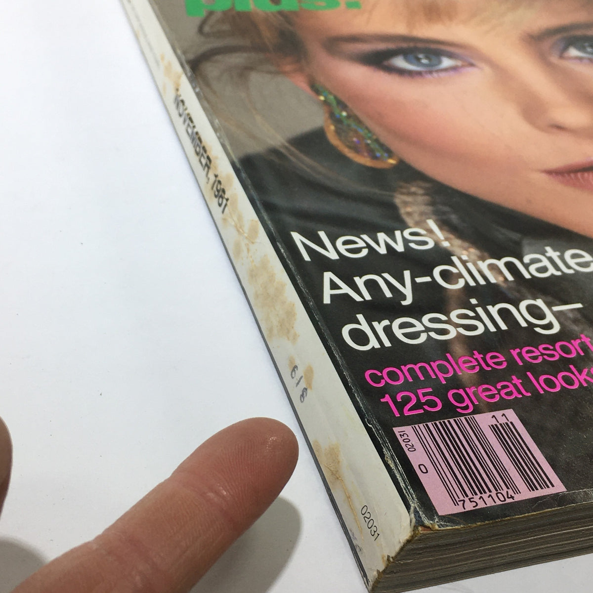 Side view of VTG Vogue Magazine from November 1981, showcasing minor wear and tear with details of the magazine's title and features. A collectible piece for vintage magazine enthusiasts.