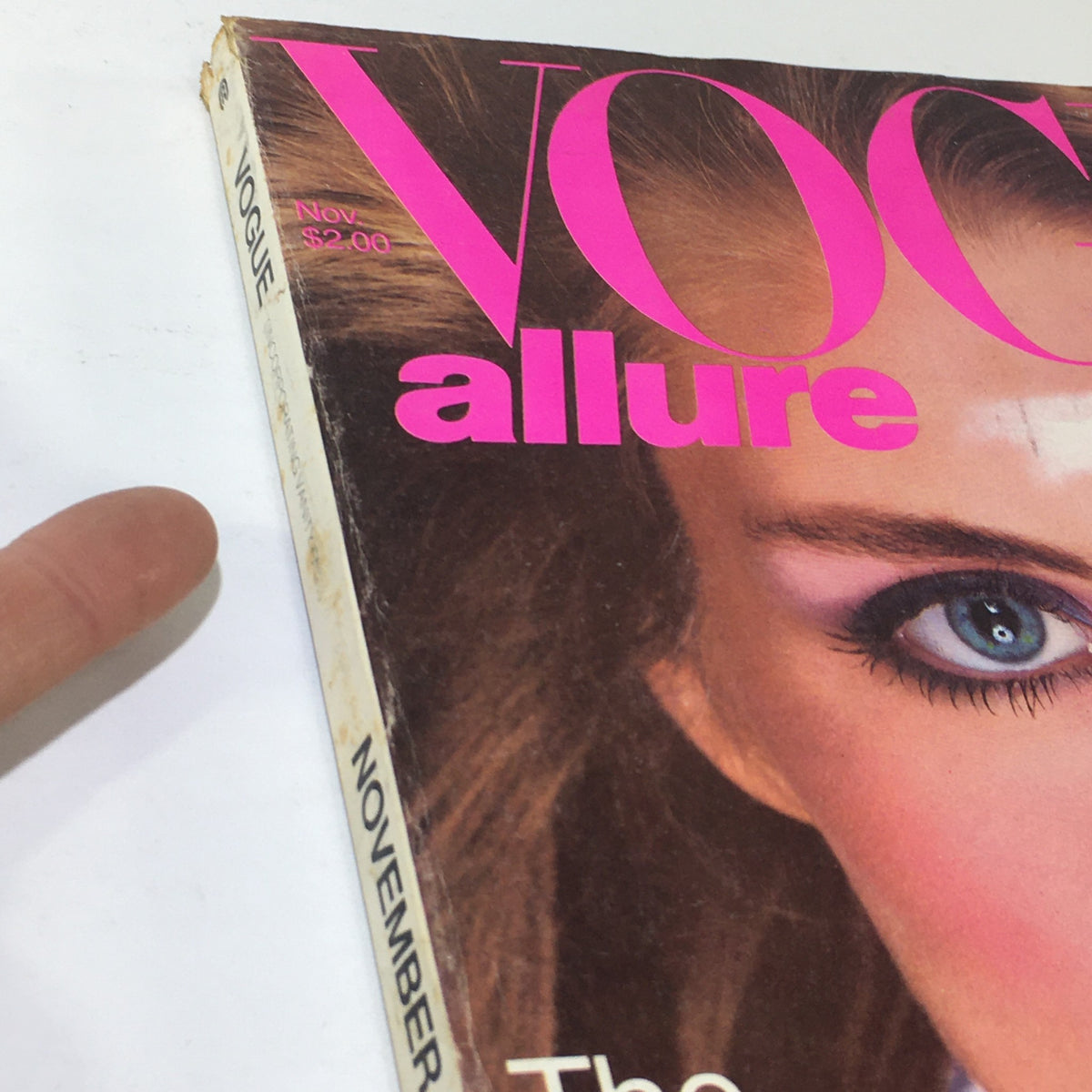 Close-up view of the cover of VTG Vogue Magazine: November 1980 showing Kim Alexis and detailed text highlighting fashion trends.