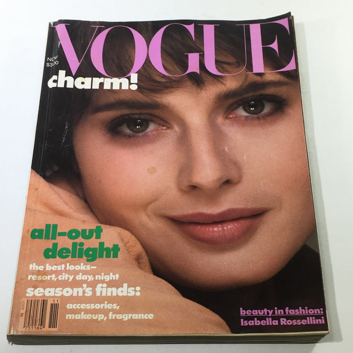 VTG Vogue Magazine: November 1982 - Isabella Rossellini Cover showcasing the model's captivating gaze and soft makeup, highlighting a classic fashion era.