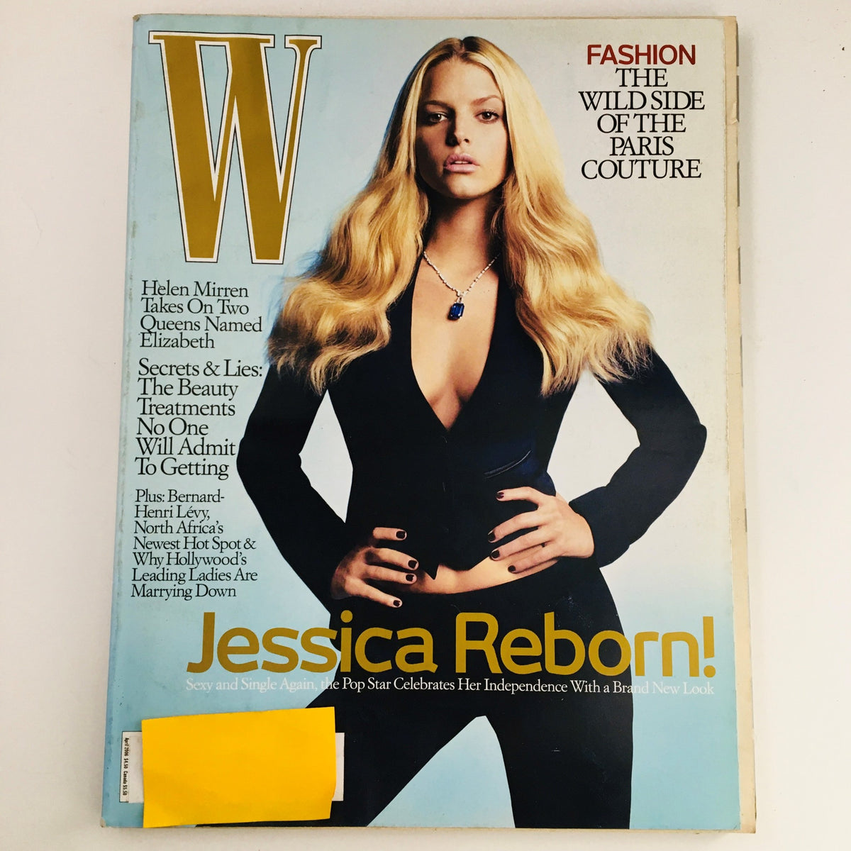 Cover of W Magazine April 2006 featuring American singer Jessica Simpson in a chic black outfit, alongside a feature on actress Helen Mirren, with a focus on fashion and pop culture.