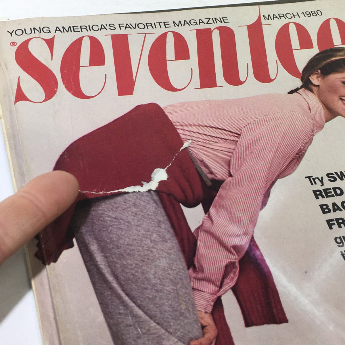 Close-up view of the March 1980 Seventeen Magazine cover highlighting a fashion model in red cowboy boots with visible wear and tear on the magazine, emphasizing its collectible nature.