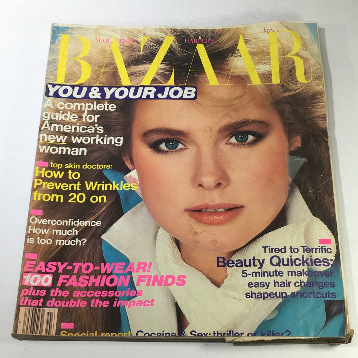 VTG Bazaar Magazine: March 1984 - Nancy DeWeir Cover featuring a close-up of a model with striking blue eyes and light makeup, highlighting vintage fashion trends.