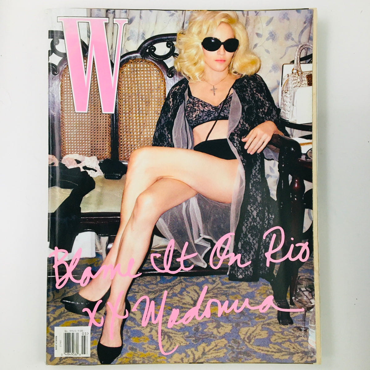W Magazine March 2009 cover featuring singer Madonna in a striking pose, emphasizing her fashion and style in the editorial titled 'Material Things'.