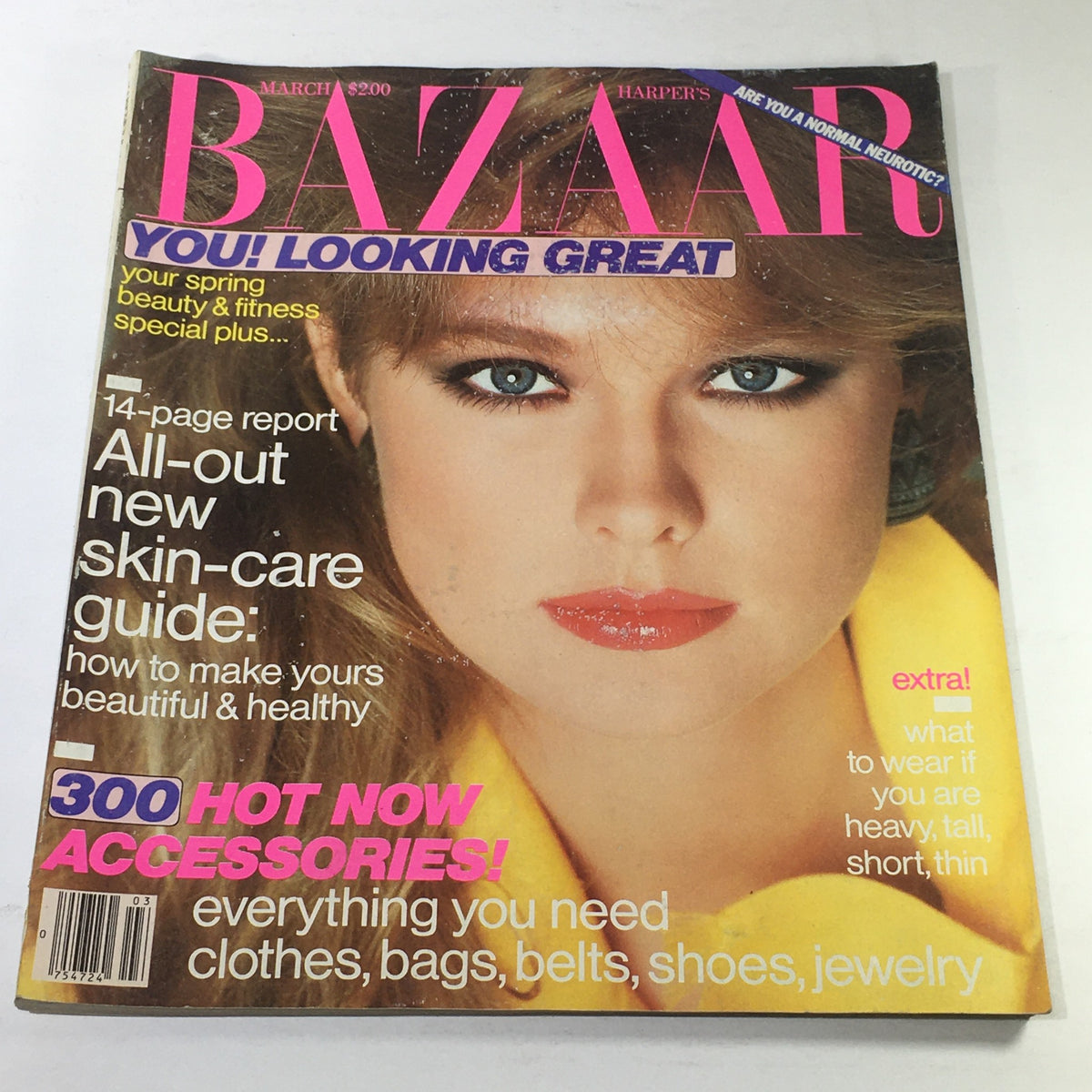 Cover of VTG Bazaar Magazine: March 1982 featuring a striking image of a model with bold makeup and a yellow jacket, emphasizing spring beauty and fitness.