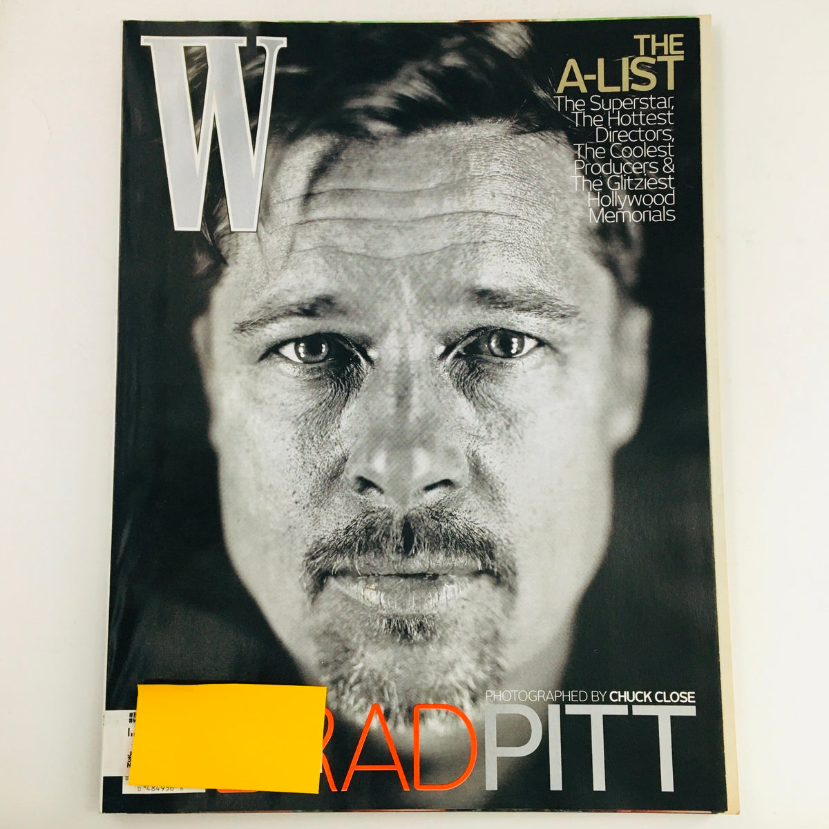 W Magazine February 2009 cover featuring Brad Pitt, photographed by Chuck Close, showcasing a stunning black and white portrait. A collectible vintage magazine highlighting celebrity culture and contemporary artistry.