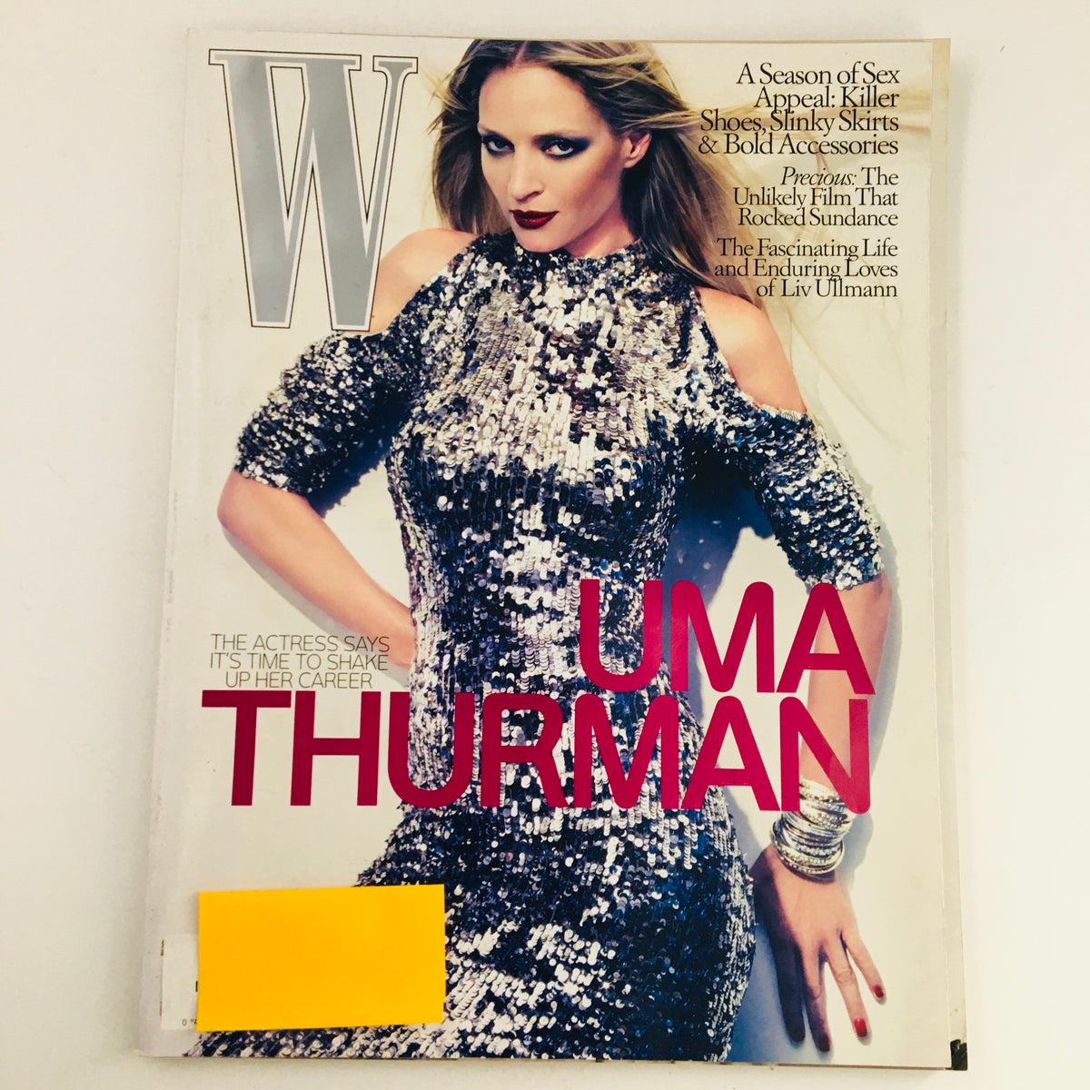 W Magazine October 2009 featuring Uma Thurman on the cover, showcasing her in a glamorous sequined outfit, with bold headlines and a vintage aesthetic.
