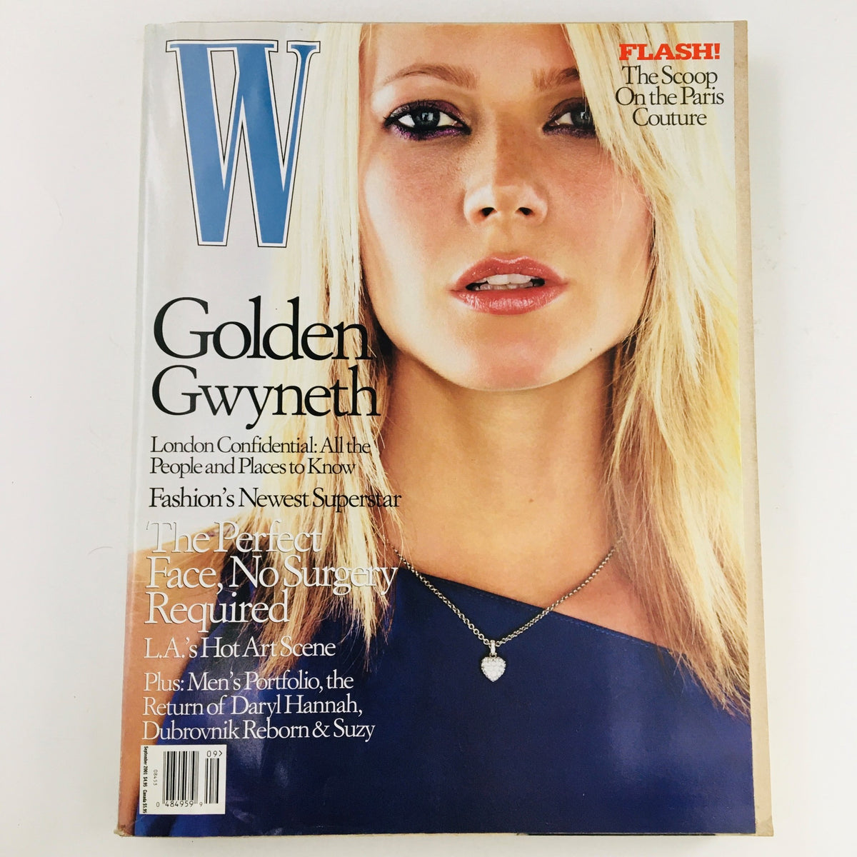 Cover of W Magazine September 2001 featuring Golden Gwyneth Paltrow, highlighting fashion and beauty trends, with a focus on her striking gaze and elegant jewelry.