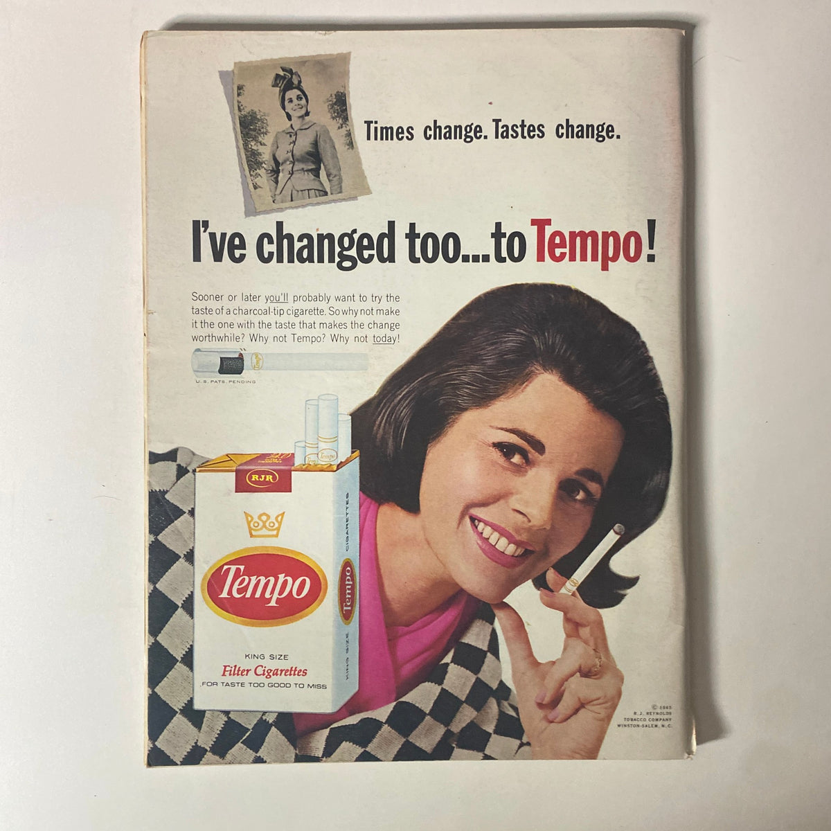 Back cover advertisement from Time Magazine November 18, 1966 Vol 88 No. 21 promoting Tempo cigarettes, featuring a woman smiling and holding a cigarette.