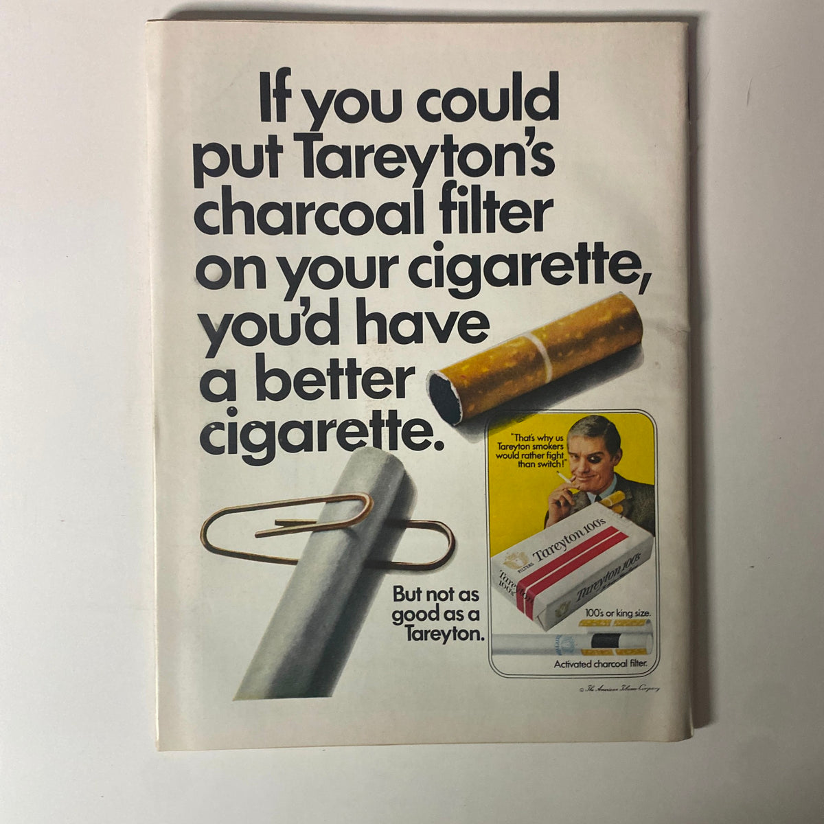 Advertisement from Time Magazine, May 23, 1969, featuring Tareyton cigarettes, illustrating the product's charcoal filter benefits.